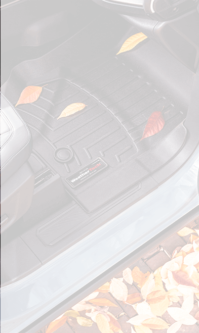 A laser-measured FloorLiner protecting a car's floor from yellow and brown leaves A laser-measured FloorLiner protecting a car's floor from yellow and brown leaves